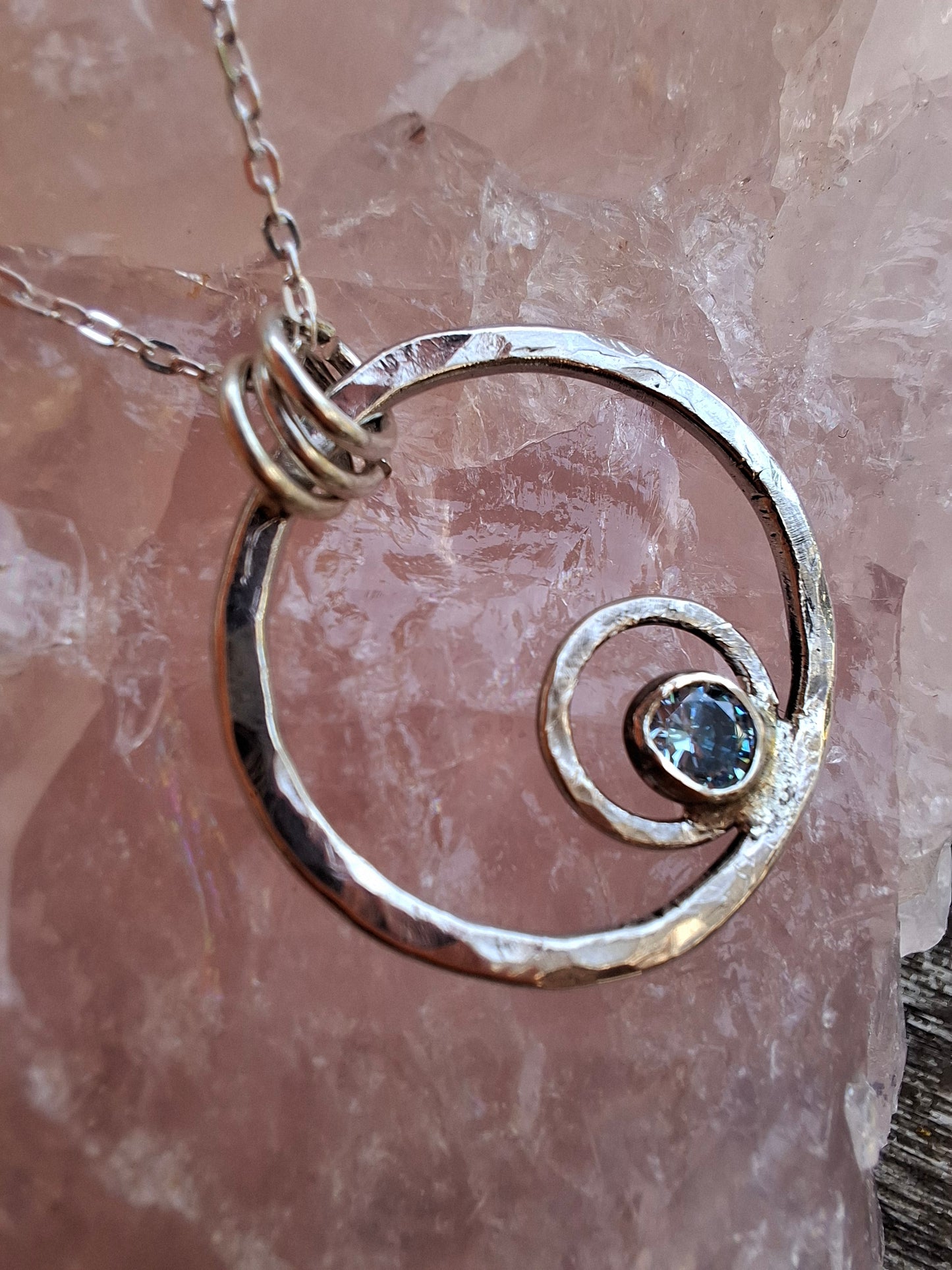 Hammered ripple circles pendant with blue zircon