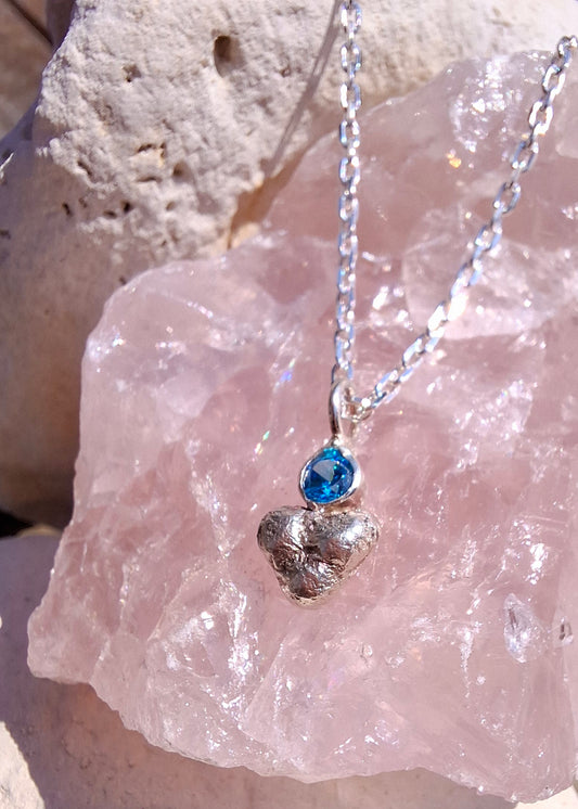 Dinky silver pebble heart and sparkly aquamarine cubic zirconia