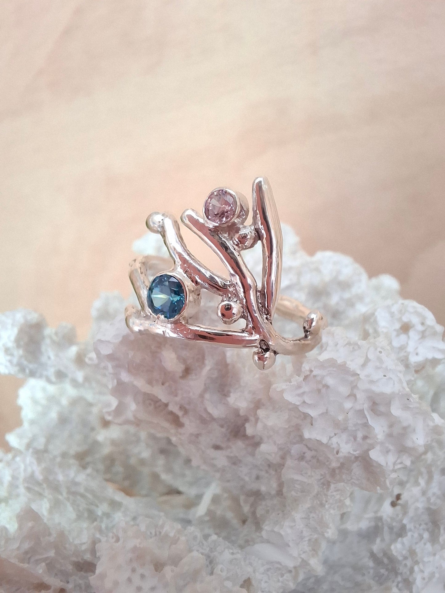 Coral inspired sterling silver ring with aquamarine and rose pink cubic zirconia stones.