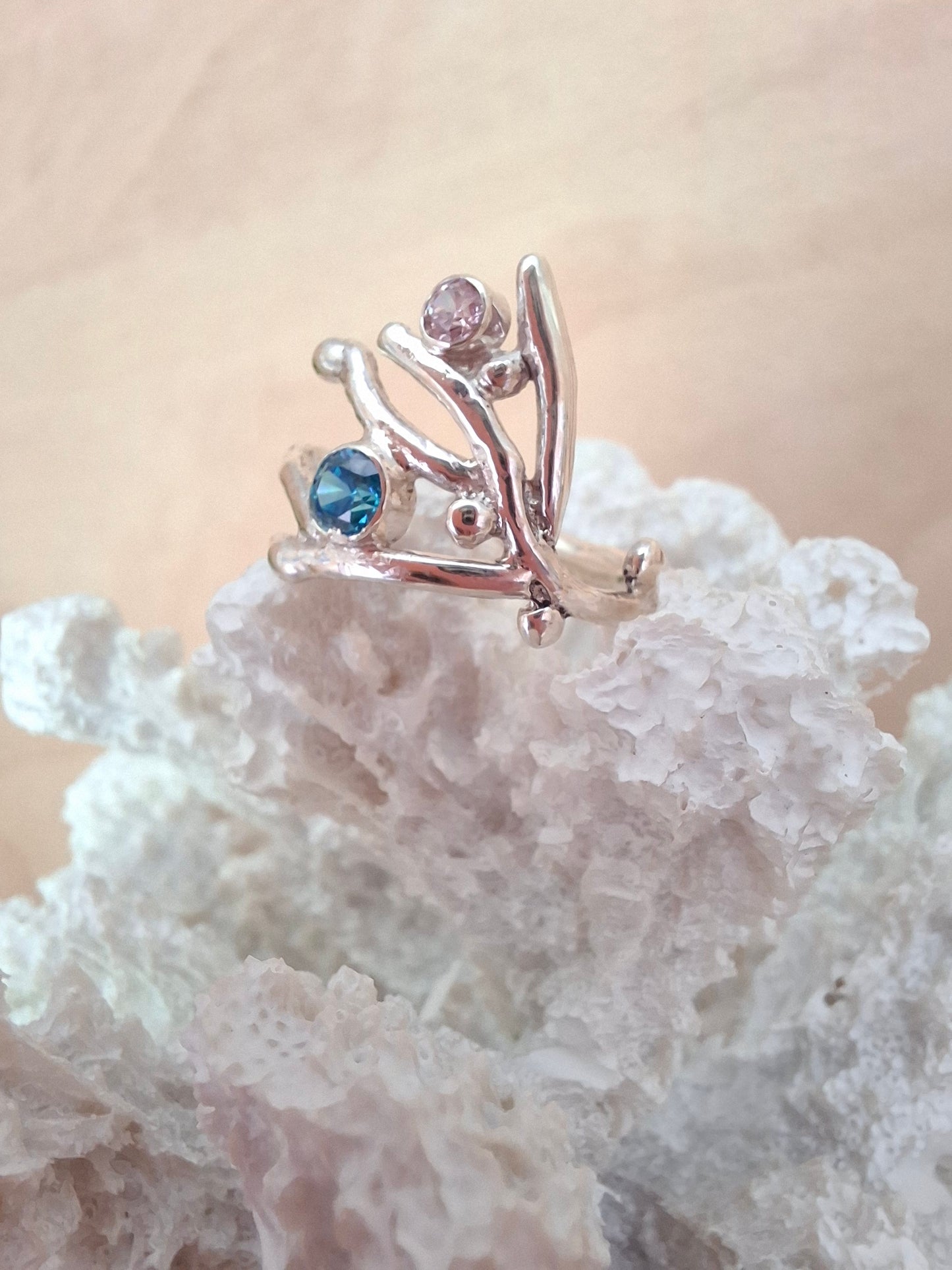 Coral inspired sterling silver ring with aquamarine and rose pink cubic zirconia stones.