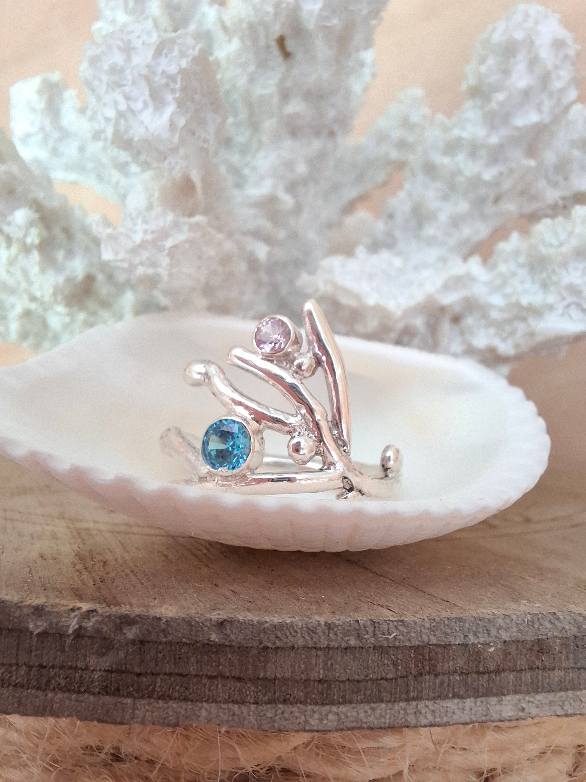 Coral inspired sterling silver ring with aquamarine and rose pink cubic zirconia stones.