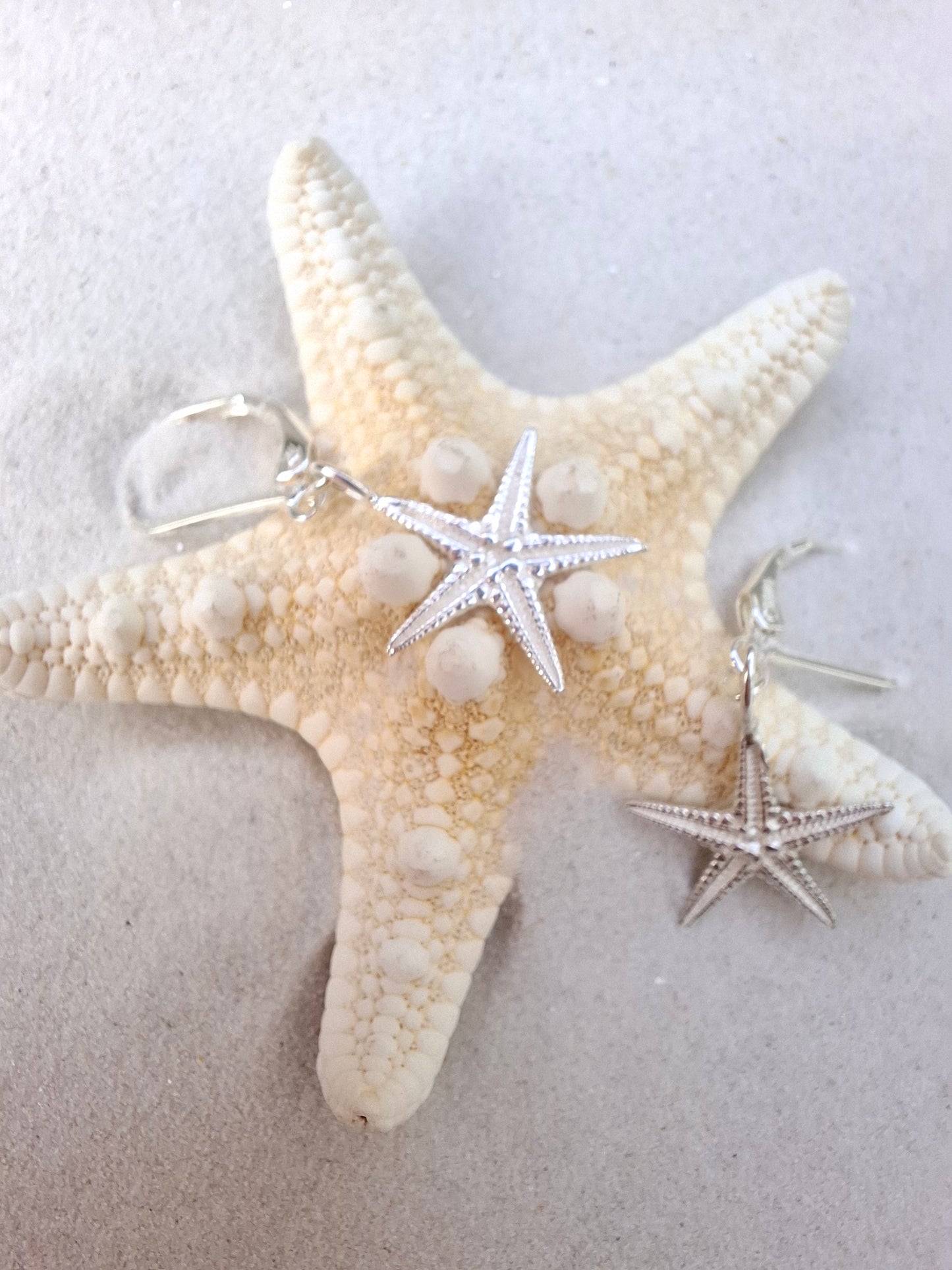 Cast silver starfish dangly earrings