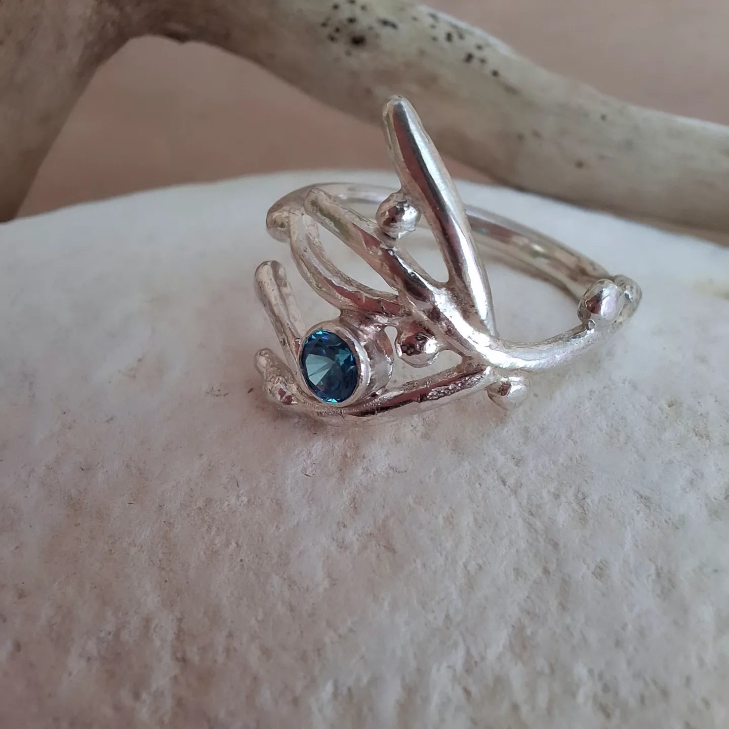 Coral inspired sterling silver & aquamarine cubic zirconia ring.