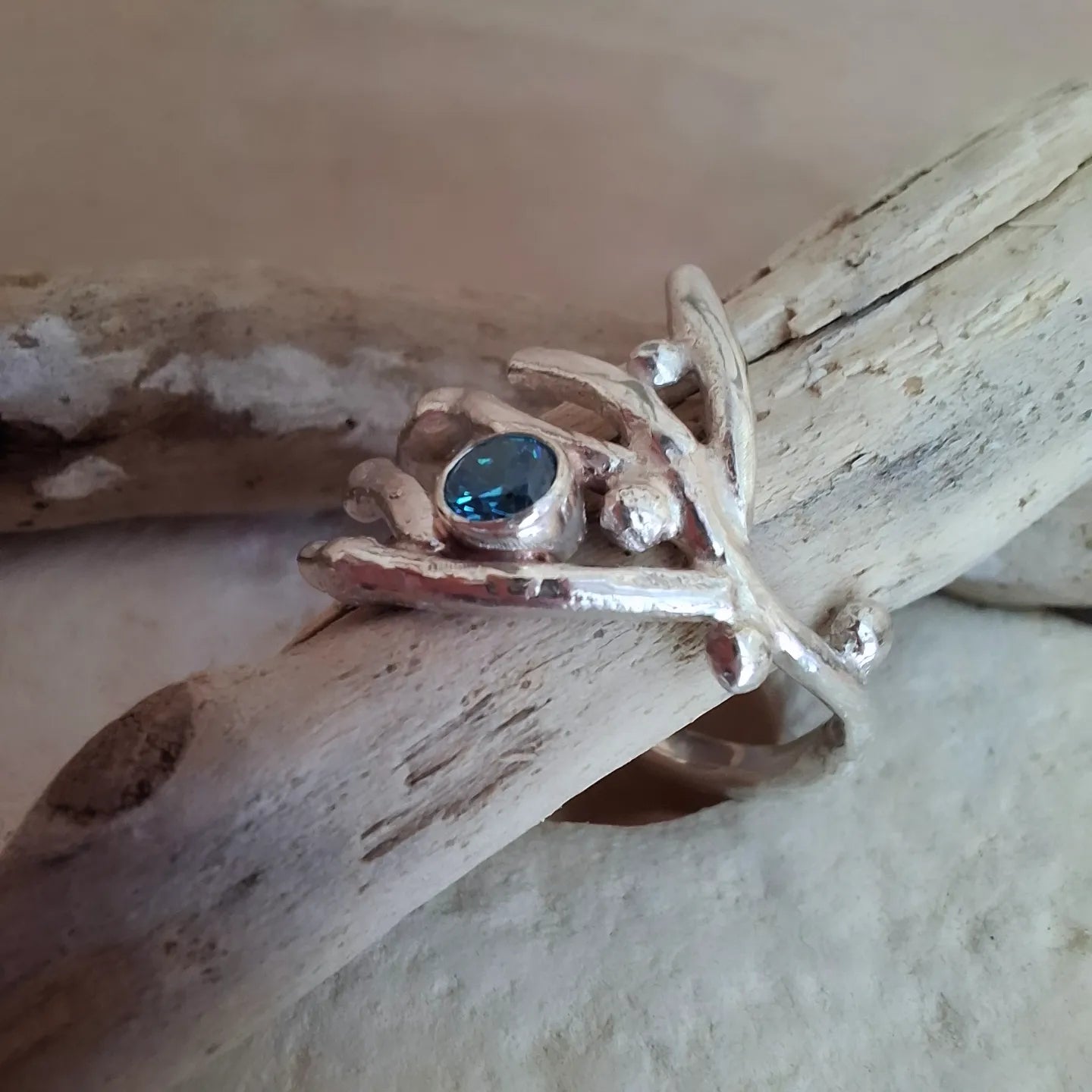 Coral inspired sterling silver & aquamarine cubic zirconia ring.