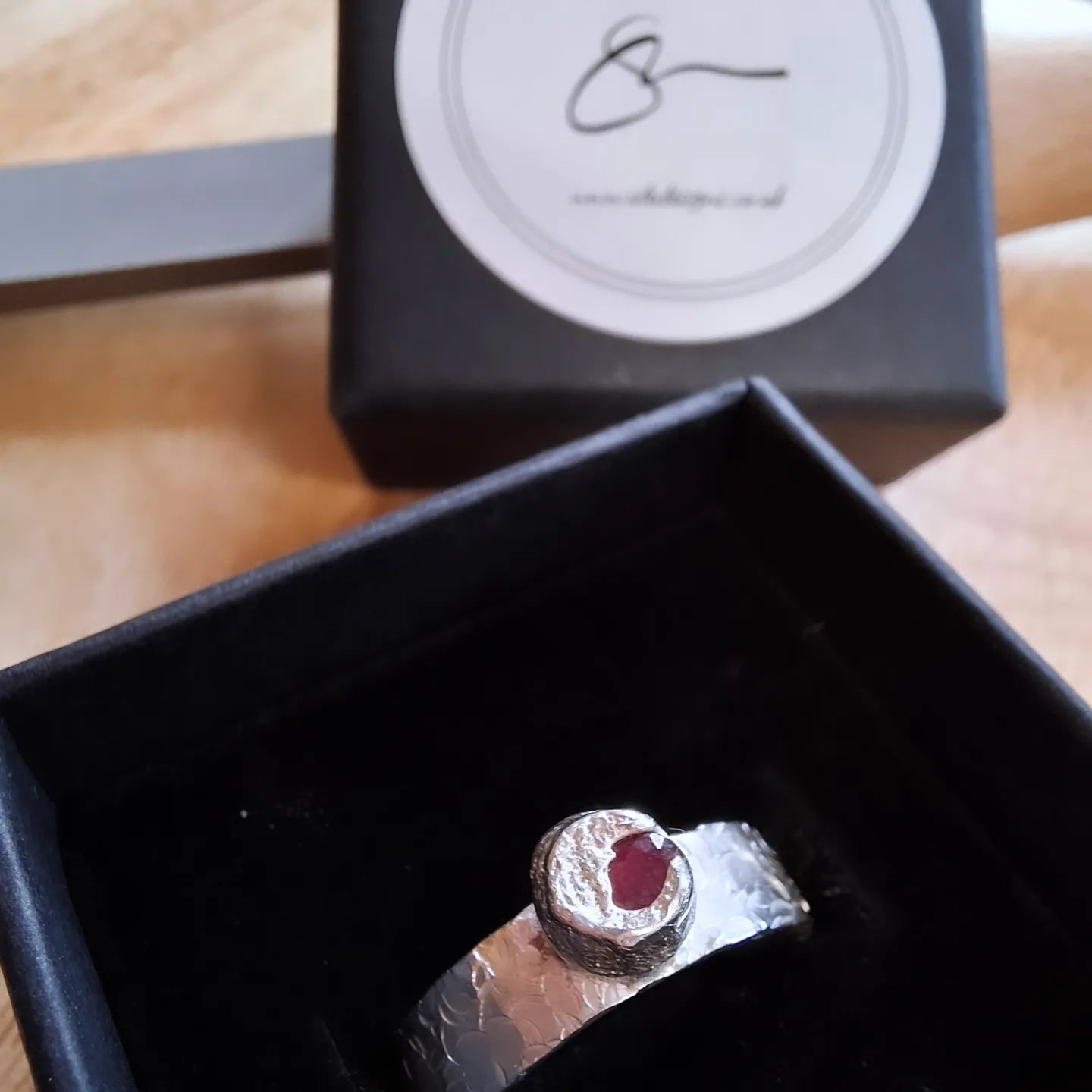 Ruby & silver hammered ring